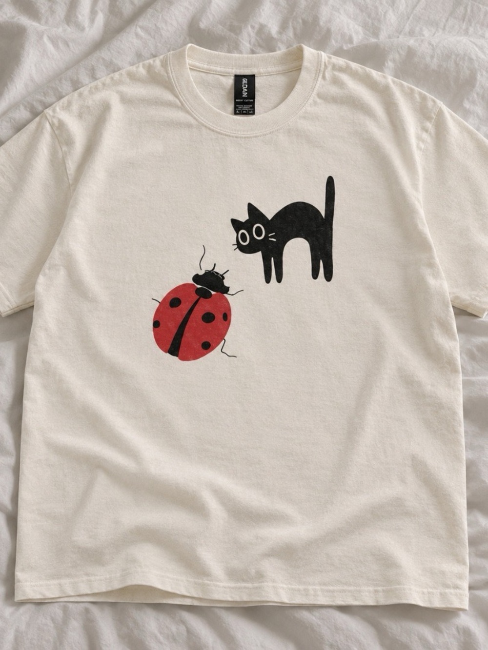 Gildan Cream Tee with Black Cat and Red Ladybug Graphic